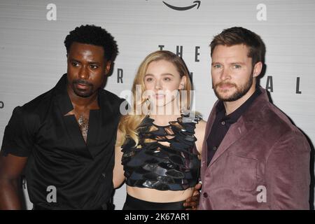 LOS ANGELES, CA - OCTOBER 11: (L-R) Gary Carr, Chloë Grace Moretz and Jack Reynor attend Prime Video's 'The Peripheral' Premiere at The Theatre at Ace Stock Photo