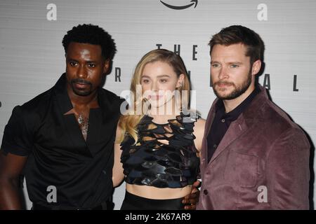 LOS ANGELES, CA - OCTOBER 11: (L-R) Gary Carr, Chloë Grace Moretz and Jack Reynor attend Prime Video's 'The Peripheral' Premiere at The Theatre at Ace Stock Photo