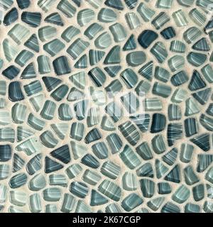 A tile wall in a bathroom in shades of blue that looks like sea glass which can be used as a background. Stock Photo