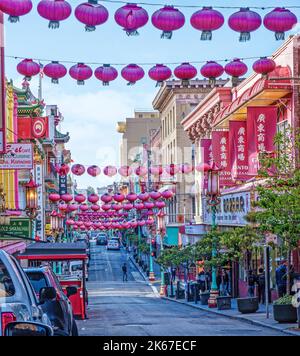 Rows of traditional Chinese red lanterns are strung across Grant Avenue, China Town, San Francisco. Facing North. Stock Photo