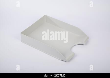 A closeup of white horizontal tray for A4 papers isolated on white background Stock Photo