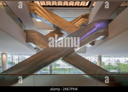 Bangkok, Thailand - Sep 30, 2022 : Interior side view of complexity multiple modern escalators (Crisscross escalators). Modern architecture of large b Stock Photo