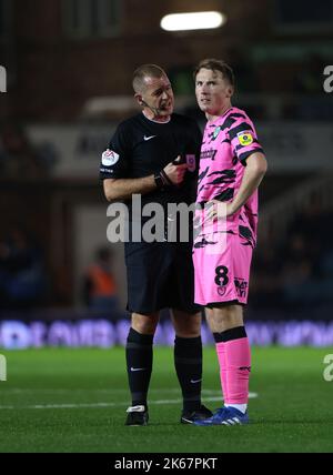 Peterborough, UK. 11th Oct, 2022. Referee Darren Handley speaks to Regan Hendry (FGR) at the Peterborough United v Forest Green Rovers, EFL League One match, at the Weston Homes Stadium, Peterborough, Cambridgeshire. Credit: Paul Marriott/Alamy Live News Stock Photo