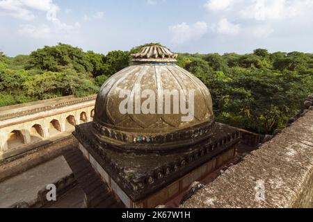 Dehli, India : Dome of the mosque within the enclosure of the Rajon ki Baoli 16th century step well in the Mehrauli Archaeological Park. Stock Photo