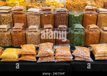 Variety types of Indian snacks selling at the booth. Stock Photo