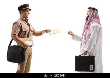 Mailman delivering a letter to a saudi arab man in ethnic clothes isolated on white background Stock Photo