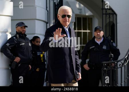 United States President Joe Biden waves to the media as he walks out from the White House in Washington, DC before his departure to Colorado on October 12, 2022.Credit: Yuri Gripas/Pool via CNP /MediaPunch Stock Photo