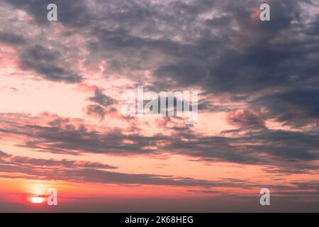lilac blue sunset pink sky fluffy clouds on gold sunset summer tropical nature background landscape Stock Photo