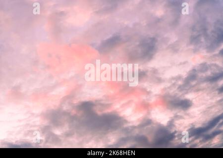 lilac blue sunset pink sky fluffy clouds on gold sunset summer tropical nature background landscape Stock Photo