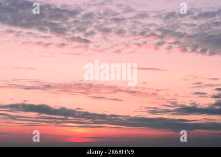 lilac blue sunset pink sky fluffy clouds on gold sunset summer tropical nature background landscape Stock Photo