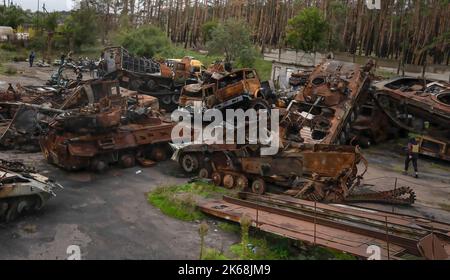 Lyman, Ukraine. 11th Oct, 2022. Multiple destroyed Russian military vehicles were seen in Lyman, a recently liberated city from Russian troops in Donetsk region. At least 32 Ukrainian soldiers' bodies have been exhumed from a mass grave in Lyman, a city in Donetsk region that was under Russian occupation. Authorities said they were buried together and initial investigation has shown some bodies were blindfolded and tied on the hands, which suggested signs of torture and execution. Another 22 civilians, including children were exhumed from another burial site nearby. Both sites located at t Stock Photo