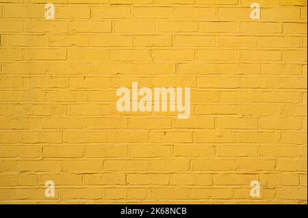 Bright Buttercup Yellow Brick Wall With Good Rough Texture. Stock Photo