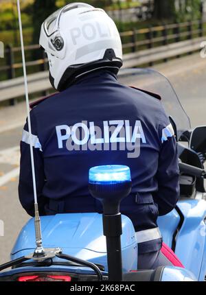 Vicenza, VI, Italy - October 9, 2022: biker policeman on motorcycle with  text POLIZIA which means POLICE in Italian language Stock Photo