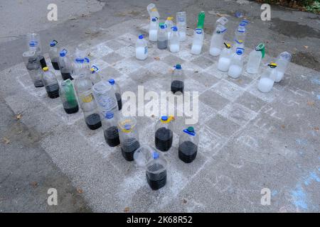 Big chess board of chalk with chess pieces made of plastic bottles seen on Franjo Tudjman Square, in Zagreb, Croatia, on October 12, 2022 Photo: Slaven Branislav Babic/PIXSELL Stock Photo
