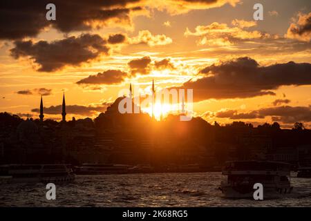 Istanbul, Turkey. 12th Oct, 2022. The sunset in Istanbul created a beautiful view with the passenger's boat passing in front of a silhouetted Suleymaniye Mosque. (Photo by Onur Dogman/SOPA Images/Sipa USA) Credit: Sipa USA/Alamy Live News Stock Photo