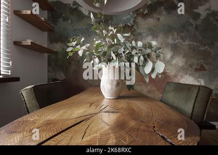 Modern Japandi appartment interior design in earth tones, natural textures with wooden solid oak furniture and clay decorative wall. Japandi concept Stock Photo