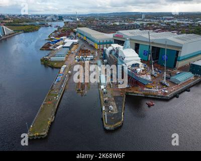 Glasgow, Scotland, UK. 12th October 2022. View of HMS Glasgow the first Type 26 anti-submarine warship being built at BAE Systems shipyard in Govan on the River Clyde in Glasgow.  BAE System is planning investment of £100 million and recruiting nearly 1,200 more workers across its UK shipbuilding division, 400 of them at Govan. The shipyard is looking forward to decade's worth of orders as ministers prepare to sign off on a deal for five more Type 26 class vessels. Iain Masterton/Alamy Live News Stock Photo