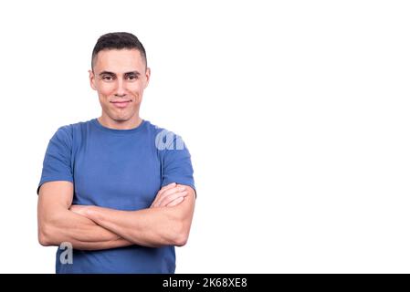 Man with arms crossed while smiling to the camera Stock Photo
