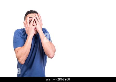 Man in fear covering his face with his hands Stock Photo