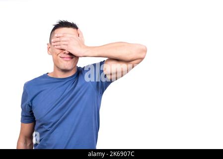 Man covering his eyes with his hand Stock Photo