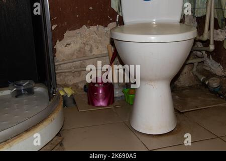 old dirty bathroom and toilet without repair in the apartment, bathroom and toilet without repair, vigilance Stock Photo