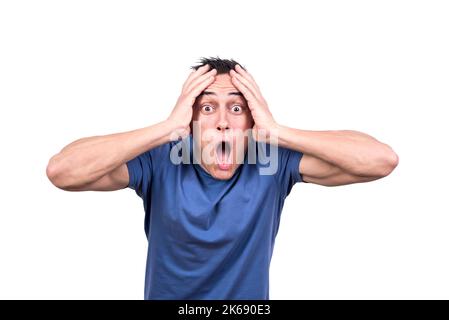 Man with hands on head and expression of despair Stock Photo