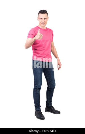 Content young guy showing thumb up and smiling Stock Photo