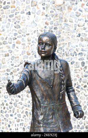 Life size bronze statue of young Swedish environmental activist Greta Thunberg. Created by Artist Christine Charlesworth. Winchester University, UK. Stock Photo