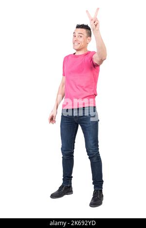 Cheerful man showing V sign. White background Stock Photo