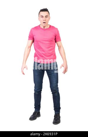 Shocked man in light studio. White background Stock Photo