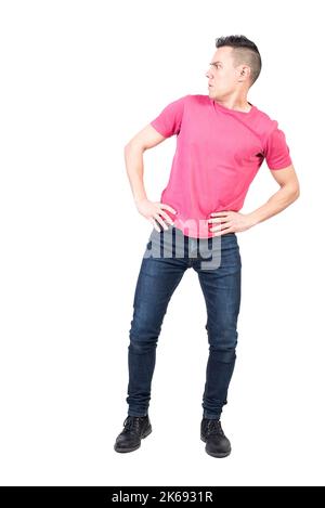 Confused man standing in studio. White background Stock Photo