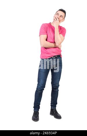 Man with dreamy look in studio. White background Stock Photo