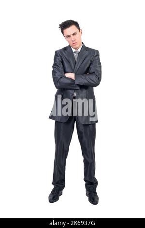 Bored elegant businessman with folded arms looking at camera Stock Photo