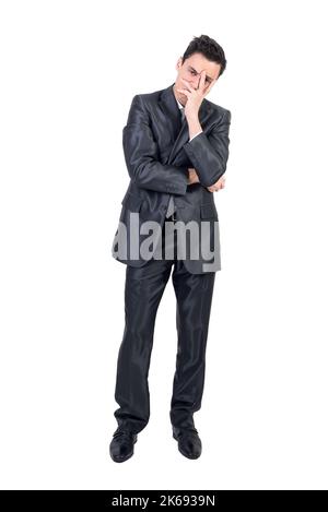 Thoughtful businessman doing facepalm gesture in studio Stock Photo