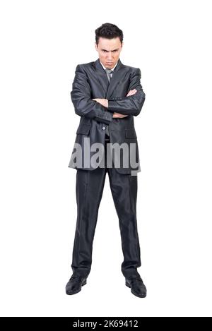 Offended businessman with crossed arms in studio Stock Photo
