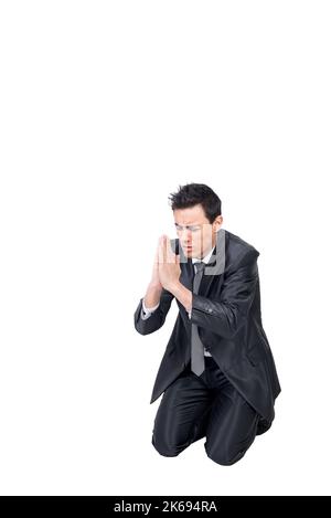 Man praying on his knees in the Omnium Sanctorum Church Stock Photo - Alamy