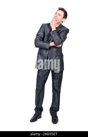 Dreamy businessman touching chin and thinking in studio Stock Photo