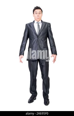Surprised male employee looking at camera in white studio Stock Photo
