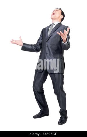 Angry young businessman shouting in white studio Stock Photo