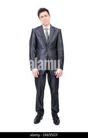 Tired young businessman standing isolated on white background Stock Photo