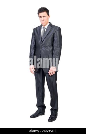 Upset young man in classy suit looking at camera Stock Photo