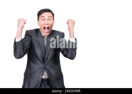 Cheerful young man screaming while celebrating successful deal Stock Photo