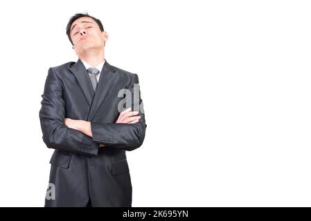 Self assured businessman with folded arms looking at camera Stock Photo