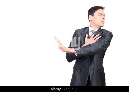 Injured male with outstretched arm in studio Stock Photo
