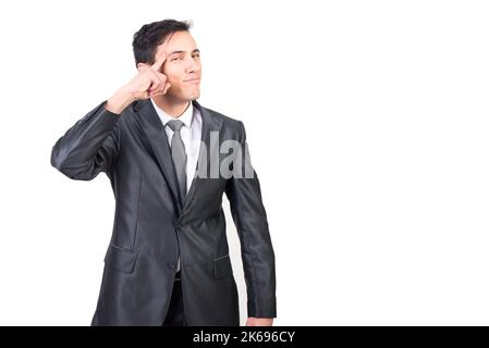 Clever man in suit pointing to head Stock Photo
