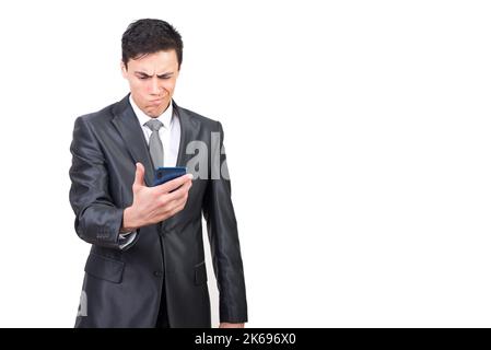 Serious man reading bad news in smartphone and feeling confused Stock Photo