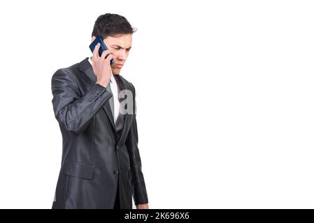 Businessman talking on smartphone and listening to bad news Stock Photo