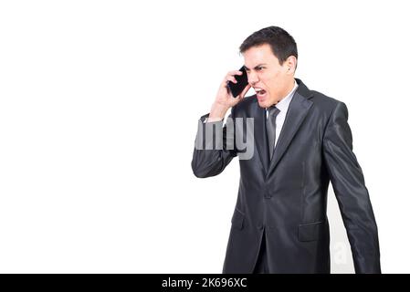 Angry businessman in suit having phone conversation Stock Photo