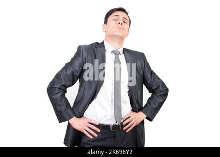 Confident young businessman in formal suit looking at camera Stock Photo