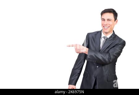 Cheerful smiling businessman pointing aside with finger Stock Photo